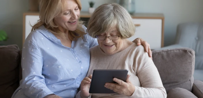 Mother and Daughter Looking at Ipad